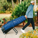 Man pulling ClubGlider3 on a trip with his golf gear