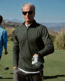 Man on a golf course wearing sunglasses and the Brett Quarter Zip 