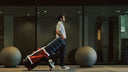 Man pulling a ClubGlider3 in an urban setting