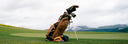 Sun Mountain x Marucci bag in black on a golf course with mountains in the background