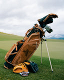Sun Mountain x Marucci bag in black on a golf course with mountains in the background