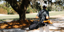Man walking on course with Matchplay Ballistic bag in black