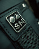 Close-up of Sun Mountain logo on Matchplay Ballistic golf bag