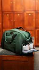 Matchplay Ballistic duffel with shoes in grove staged in a locker room 