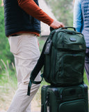 Man with the Matchplay Ballistic backpack and carry-on in Grove