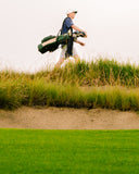 Ryggs Johnston carrying a Grove TQR Waxed Canvas golf bag