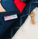 Close-up of a Hometown bag with an American flag label 