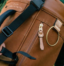 Close up shot of bronze hardware on TQR Waxed Canvas bag