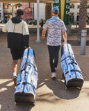 Two men walking with SMS x Bad Birdie ClubGliders on a street