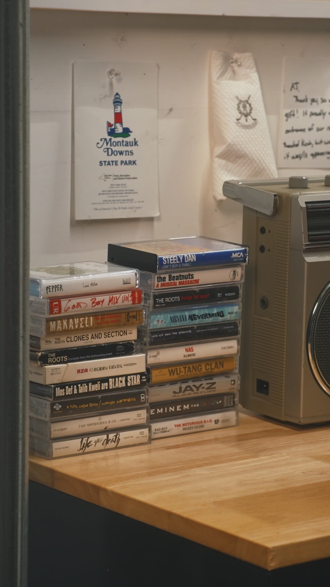 Man in garage loading a limited edition Sun Mountain x MUNICIPAL golf bag
